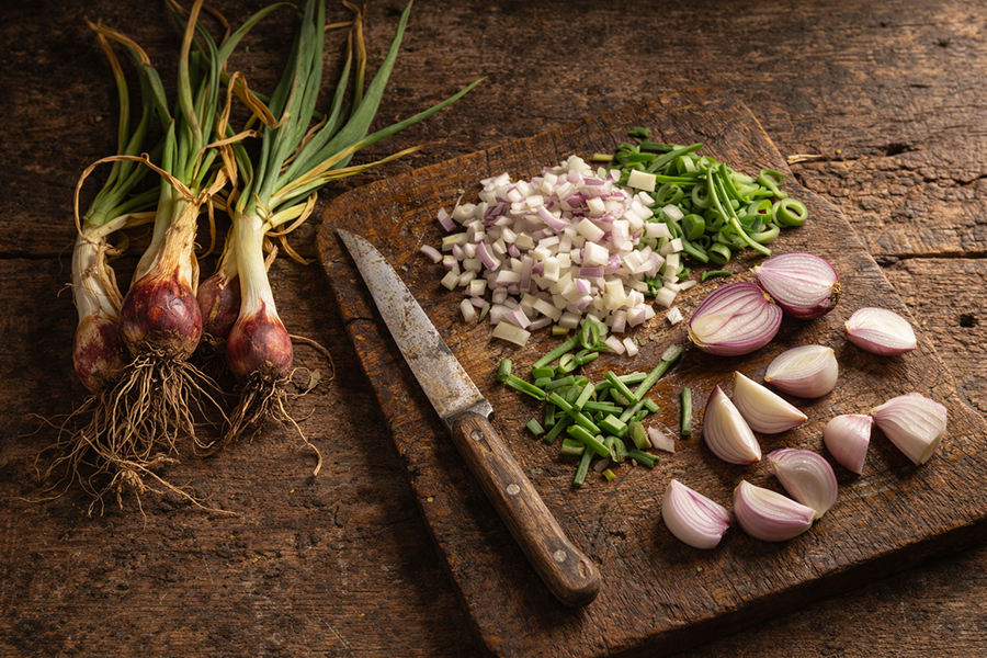 Preparing Egyptian Walking Onions for the skillet.